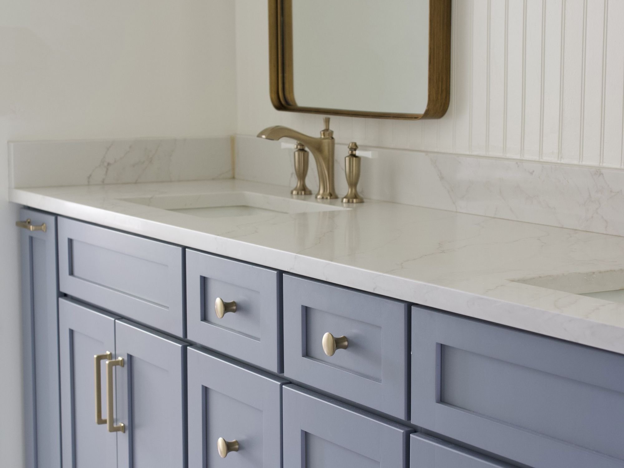 Close Up of Custom Periwinkle Vanity with Double Sinks in Bathroom Remodel by Trade Works Remodeling in Louisville