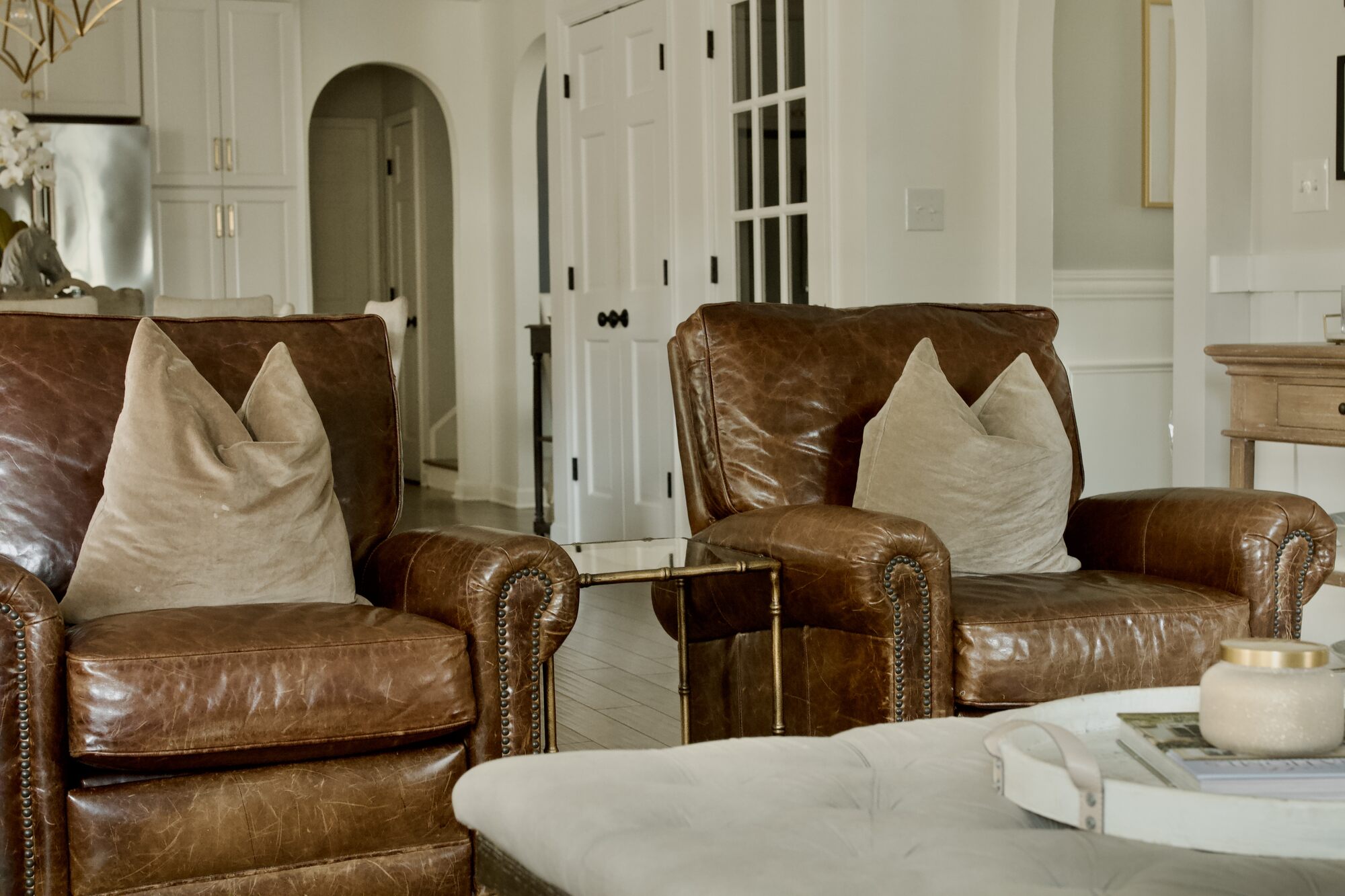 Cozy remodeled living space with leather seating by Trade Works Remodeling in Prospect, KY