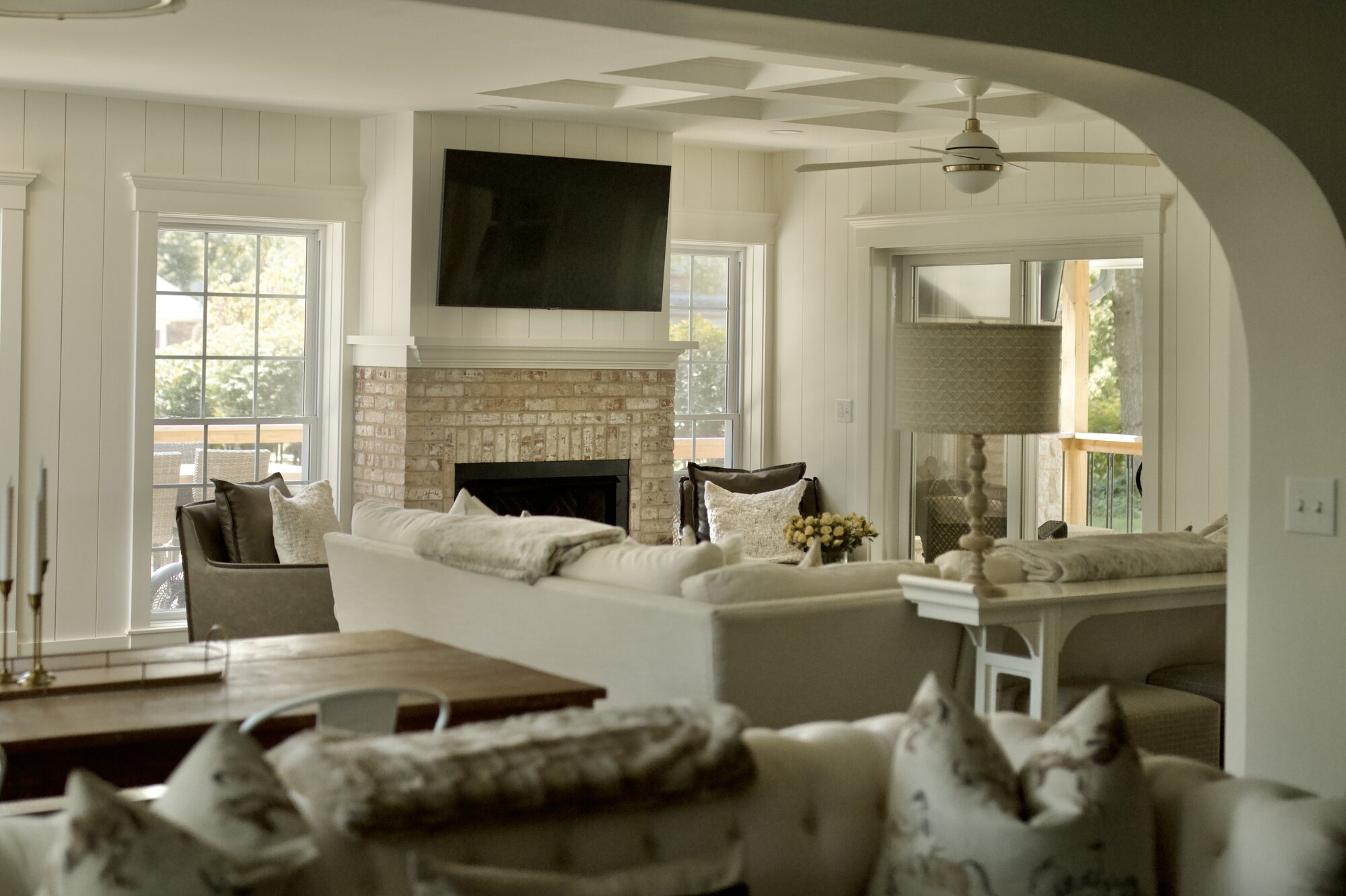 Living room remodel with large windows and fireplace by Trade Works Remodeling in Louisville, KY