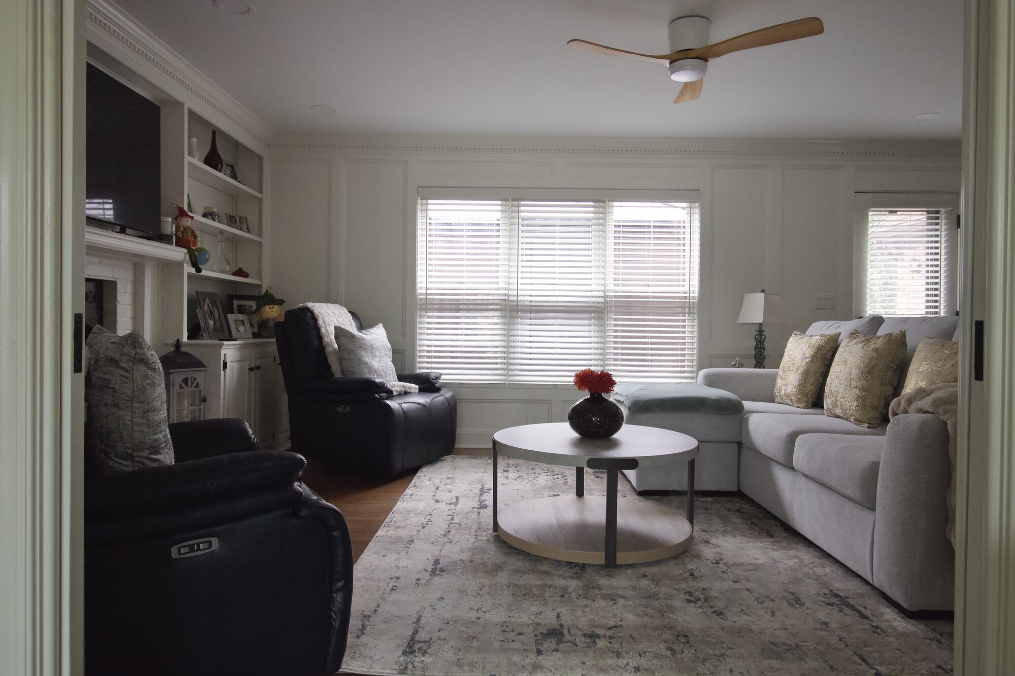 Modern living room with recliners and large sectional in Druid Hills, KY by Trade Works Remodeling