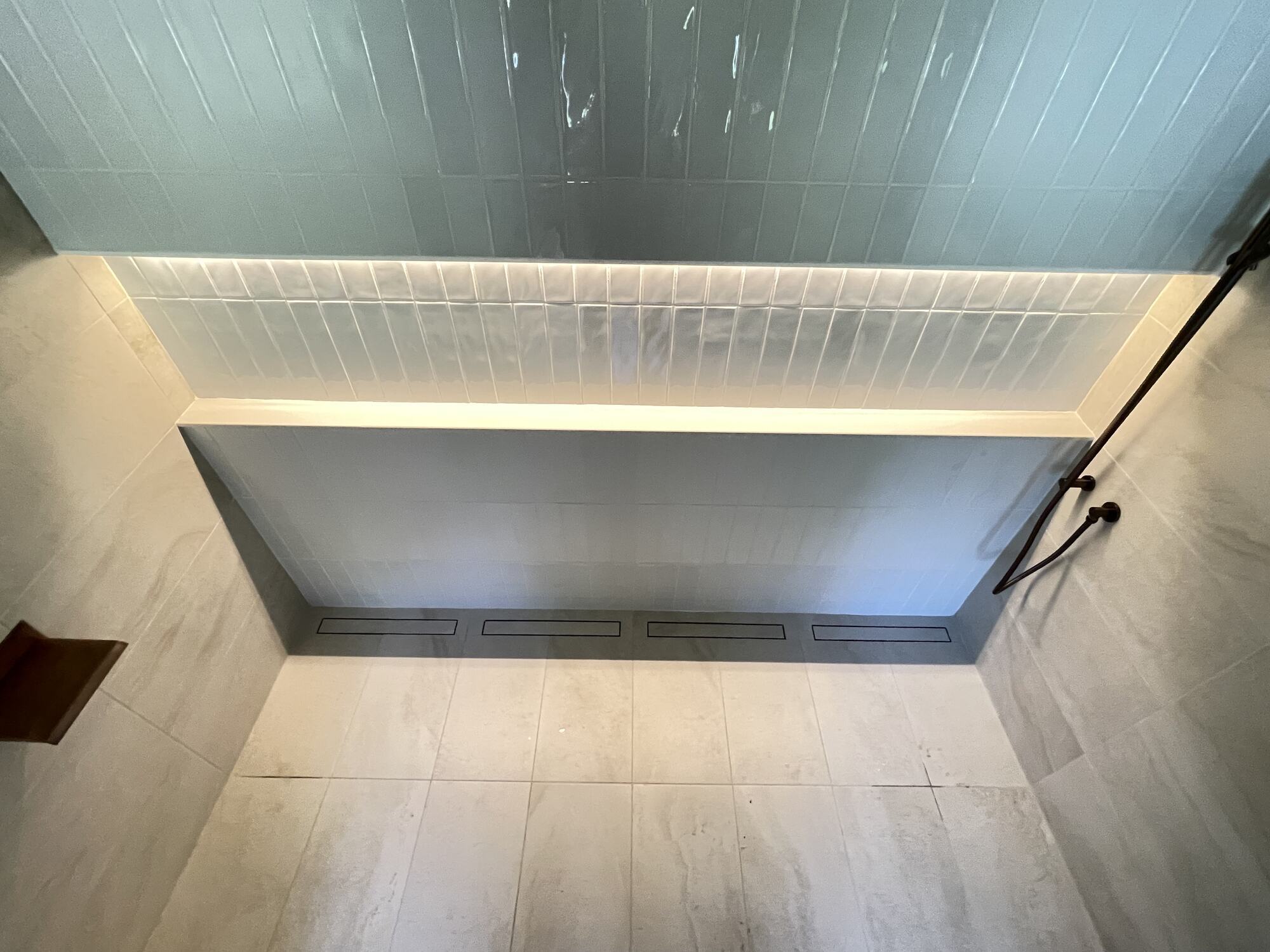Shower remodel with built-in lighting by Trade Works Remodeling in Green Spring, KY