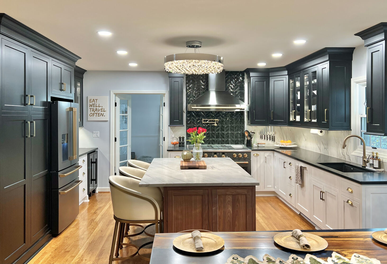 Full view of remodeled kitchen with chandelier and island seating in Jeffersontown, KY by Trade Works Remodeling