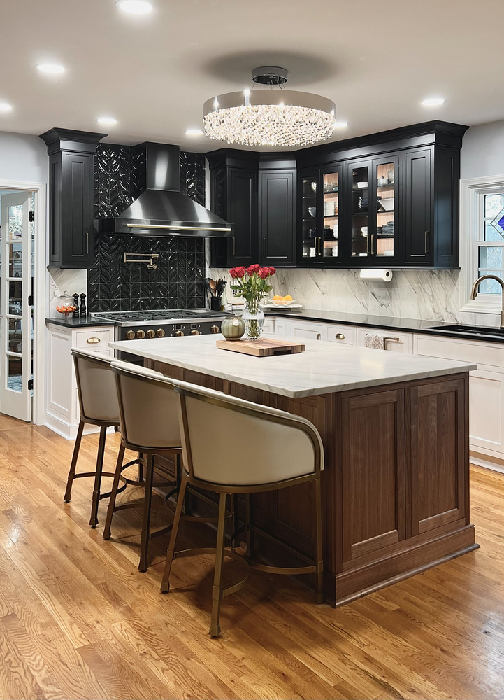 Luxury kitchen remodel in Prospect, KY featuring dark cabinetry and crystal chandelier by Trade Works Re