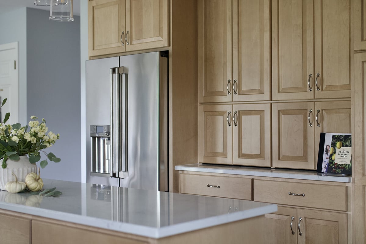 Built-in refrigerator and ample storage cabinets in a Plainview, KY home by Trade Works Remodeling