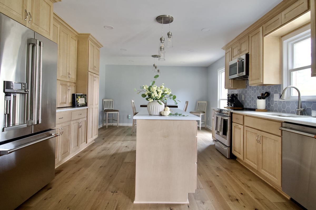 Custom kitchen renovation with quartz countertops and pendant lighting in Plainview, KY by Trade Works Remodeling