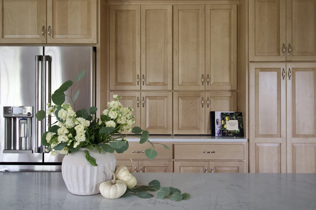 Decorative fall arrangement on island countertop in a custom kitchen remodel by Trade Works Remodeling in Plainview, KY