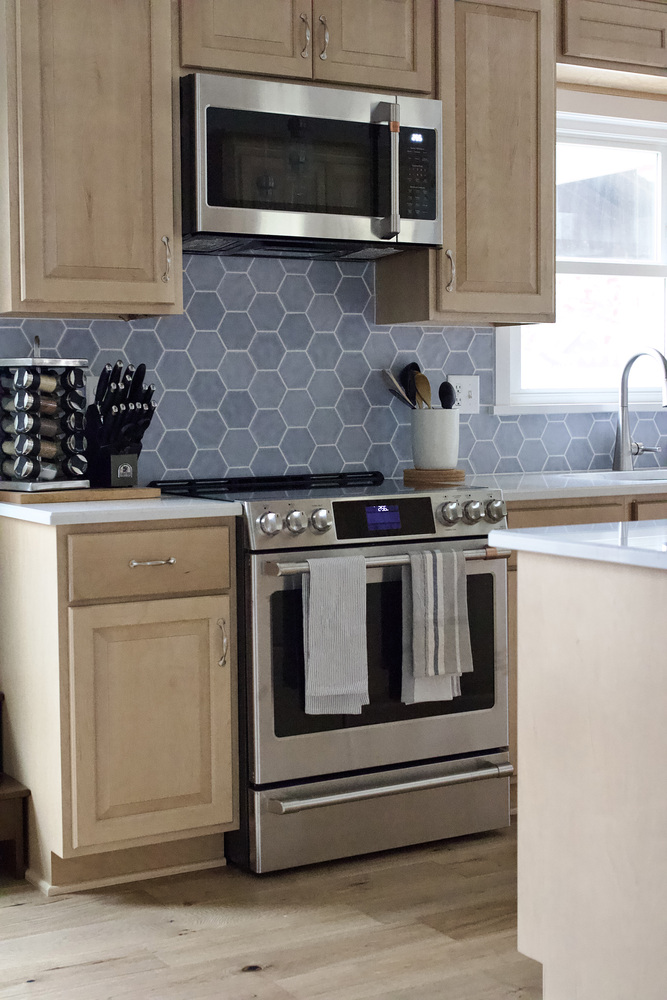 Kitchen remodel by Trade Works Remodeling in Old Brownsboro Place, KY featuring stainless steel stove and microwave