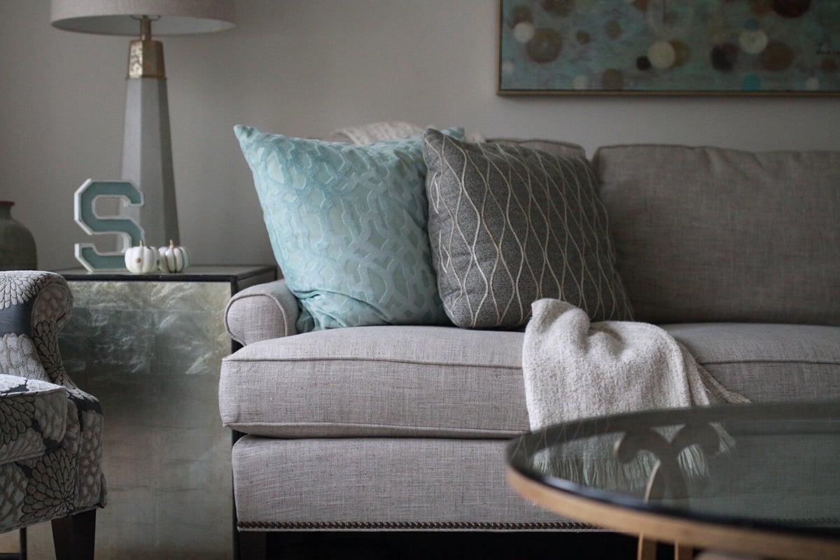 Close-up of neutral-toned sofa styling in Crestwood, KY by Trade Works Remodeling