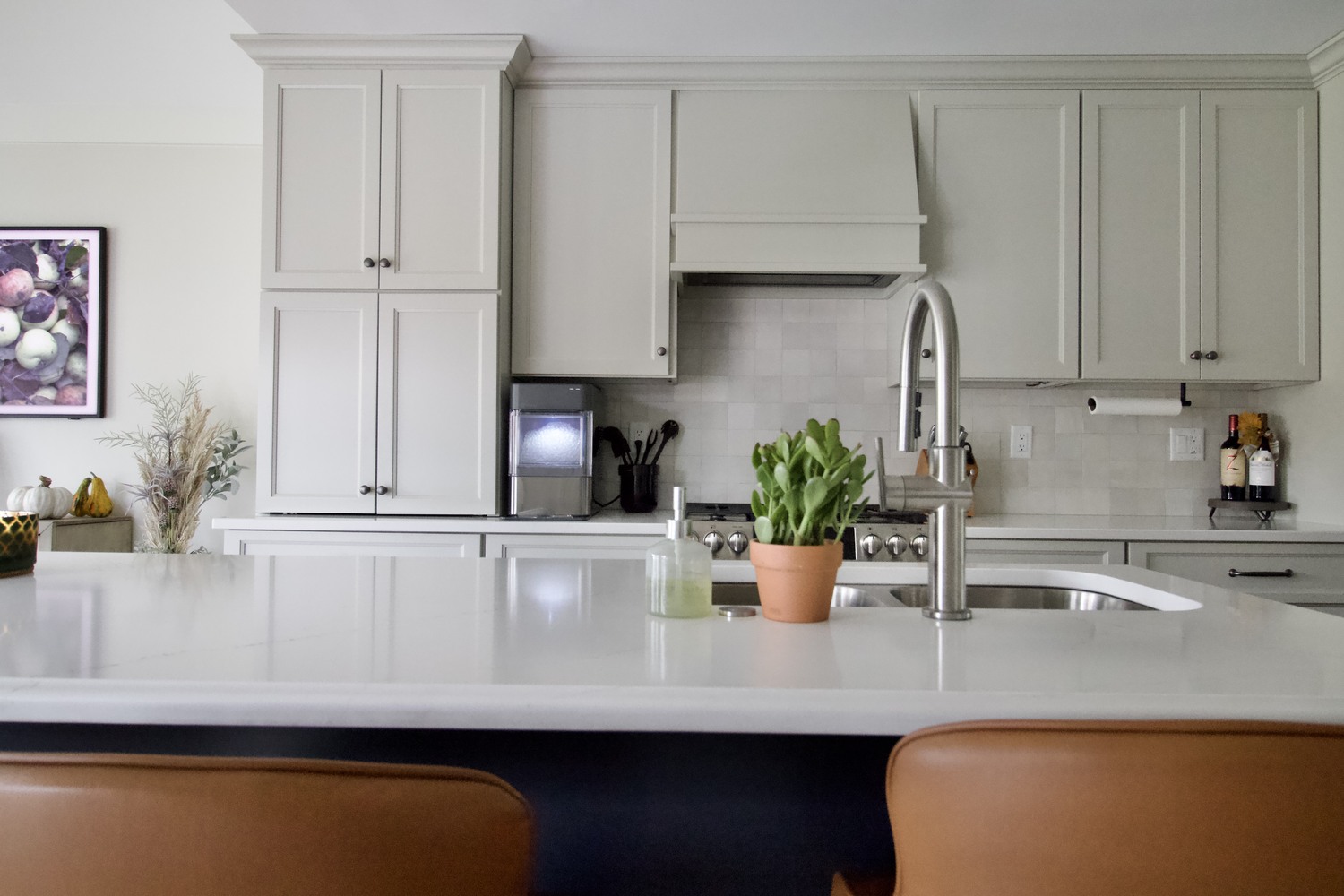 Custom kitchen island with potted plant and backsplash cabinetry in Green Spring, KY by Trade Works Remodeling