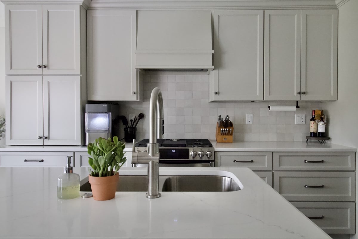 Full view of custom kitchen cabinetry and island sink in Old Brownsboro Place, KY by Trade Works Remodeling