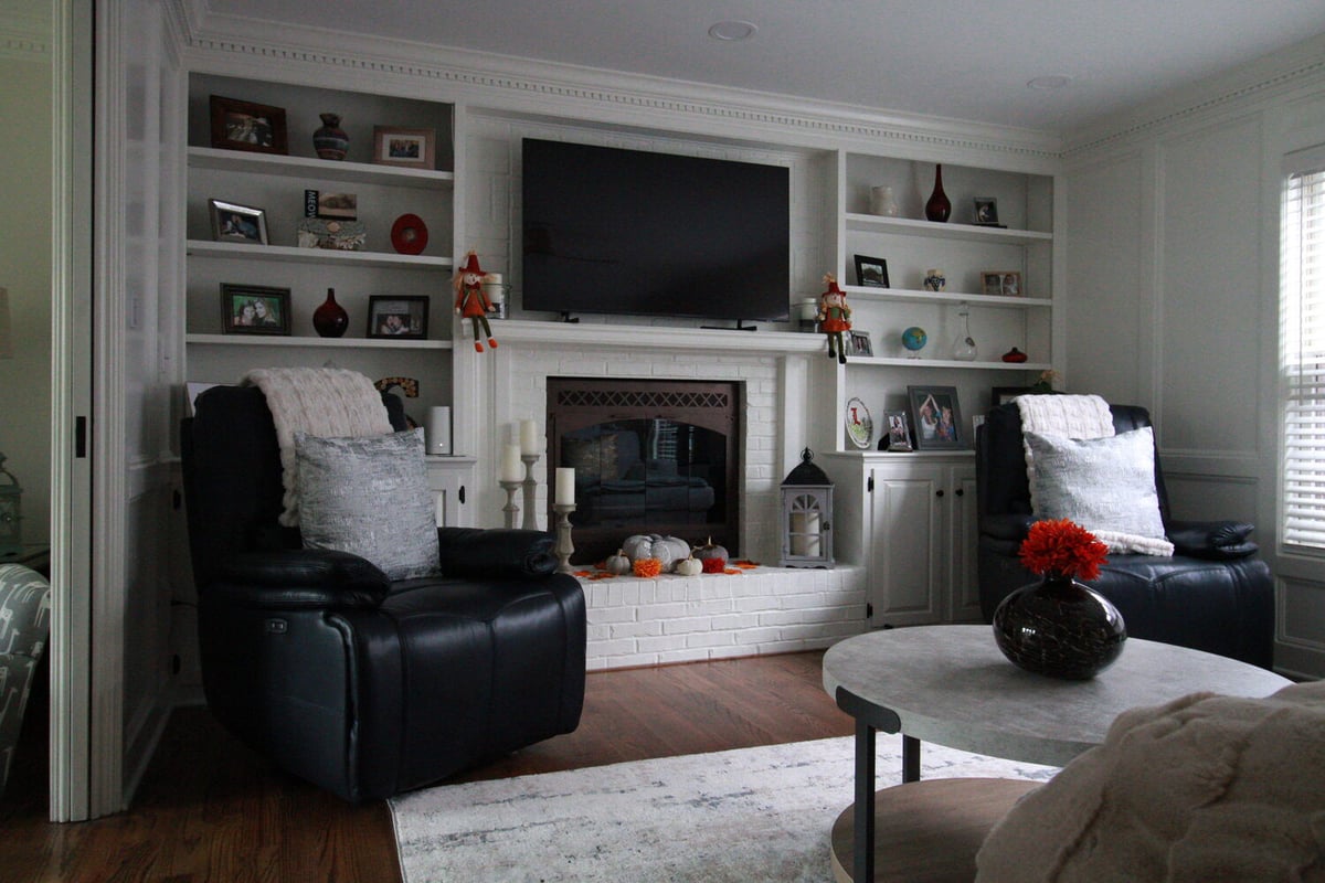 White built-in fireplace and shelving in family room remodel by Trade Works Remodeling in Green Spring, KY
