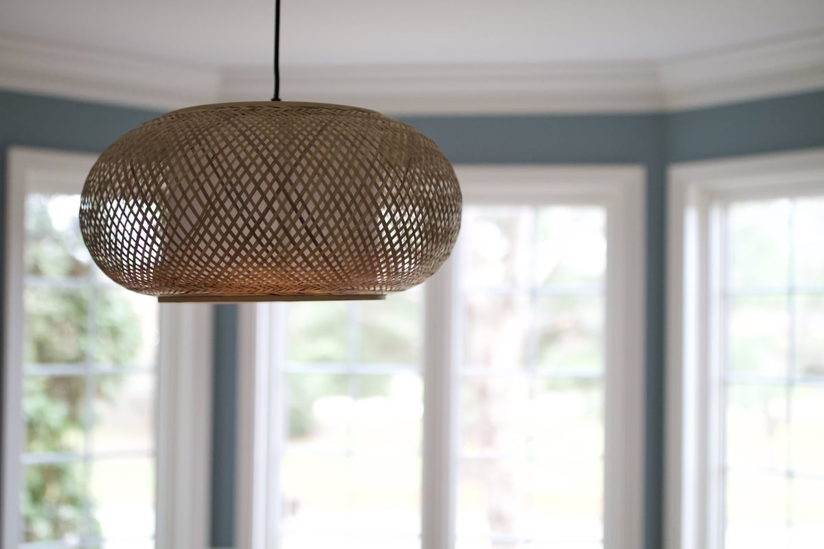 Woven pendant light fixture in custom dining space by Trade Works Remodeling in Prospect, KY