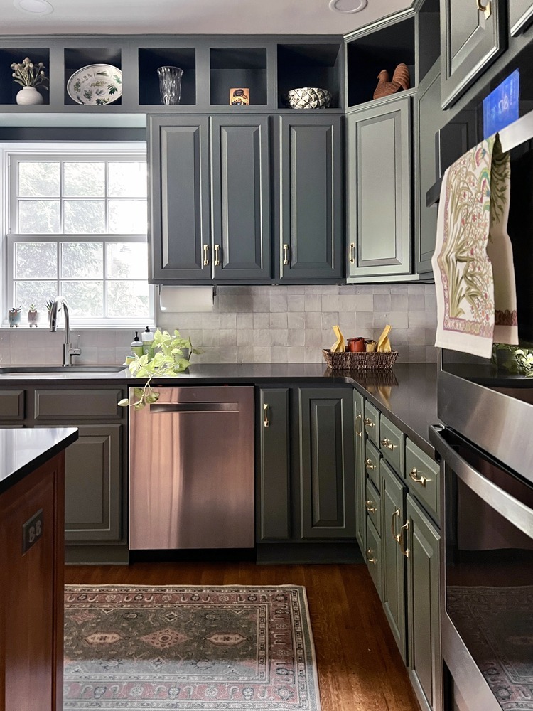 Elegant kitchen remodel with deep green cabinets and stainless steel dishwasher in Louisville, KY by Trade Works Remodeling