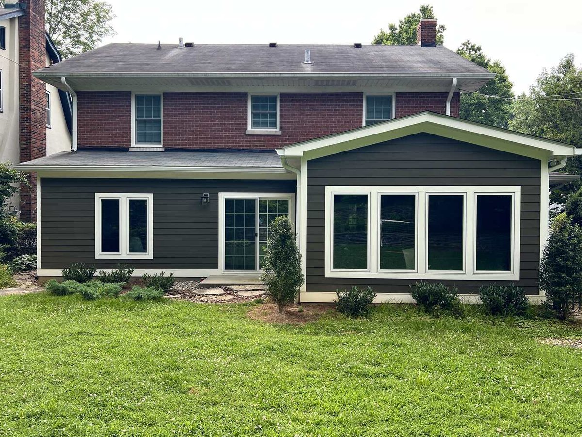 Exterior view of remodeled home addition with large windows by Trade Works Remodeling, Louisville, KY