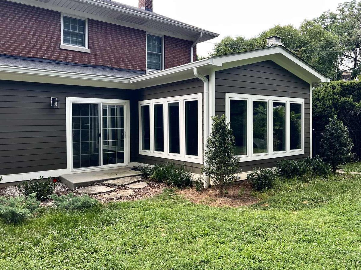 Exterior view of remodeled home addition with large windows in Louisville, KY by Trade Works Remodeling