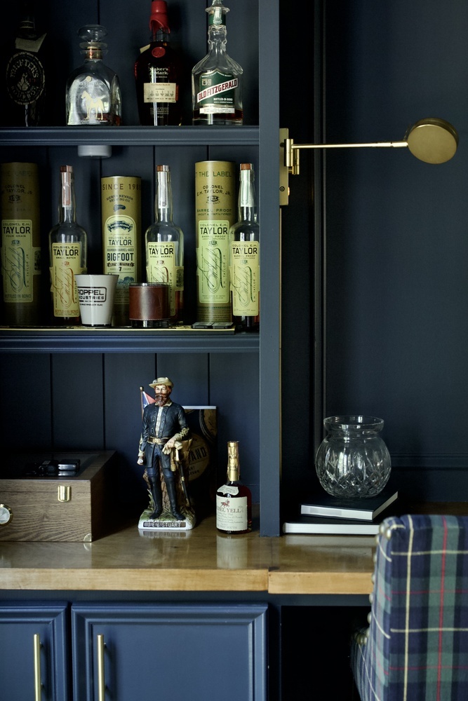 Close-up of built-in bourbon shelves featuring premium bottles in a Louisville home by Trade Works Remodeling
