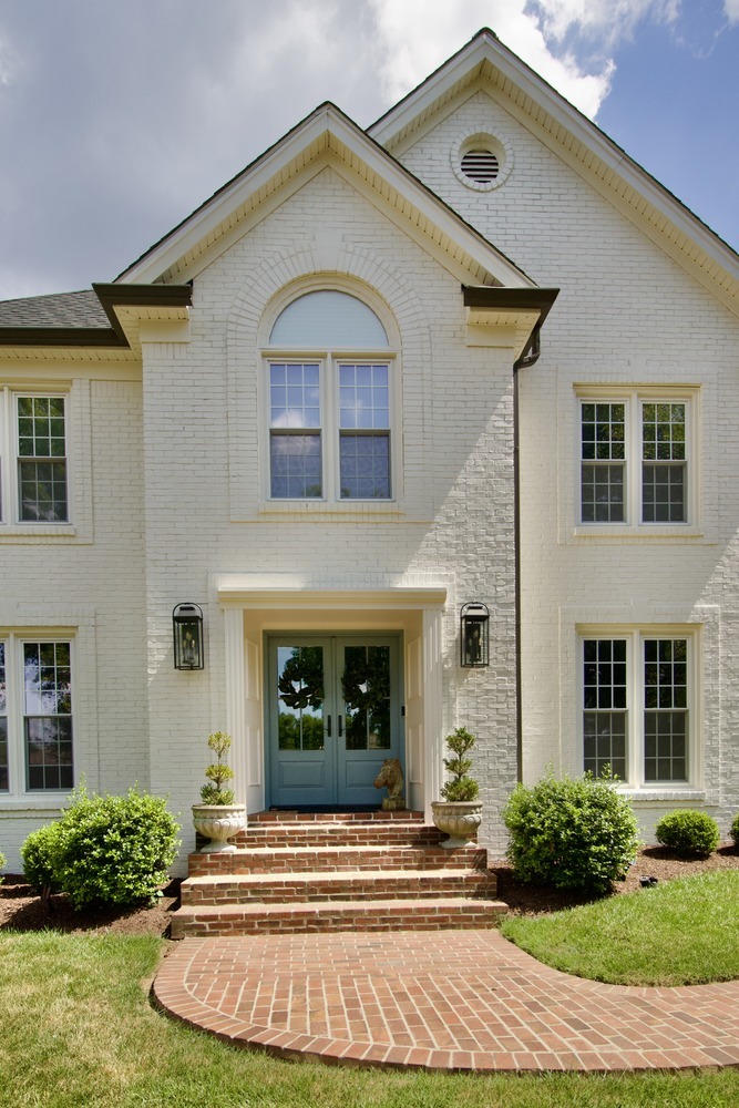 Close-up of front porch and brick walkway on a custom home by Trade Works Remodeling in Louisville, Kentucky