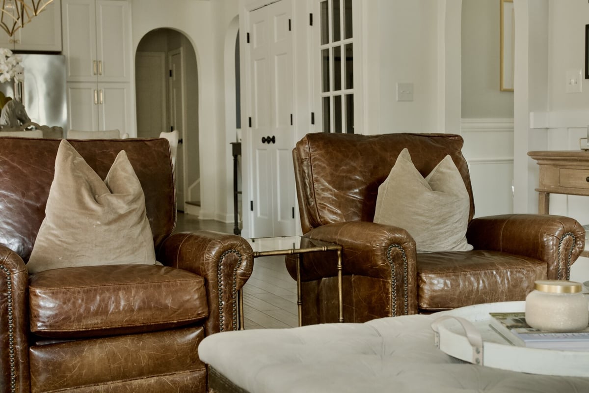 Cozy remodeled living space with leather seating by Trade Works Remodeling in Prospect, KY