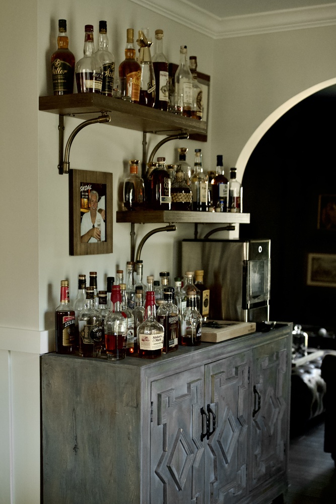 Custom home bar remodel with whiskey shelves by Trade Works Remodeling in Owl Creek, KY