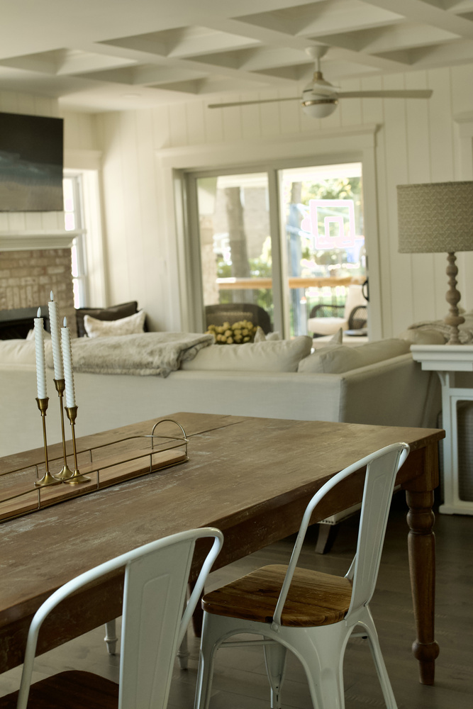 Dining and living area remodel with wood table and modern ceiling by Trade Works Remodeling in Owl Creek, KY