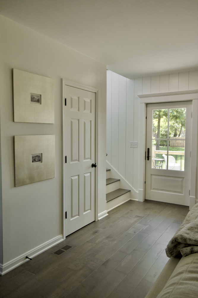 Entryway with wood floors and natural light in custom home by Trade Works Remodeling in Langdon Place, KY