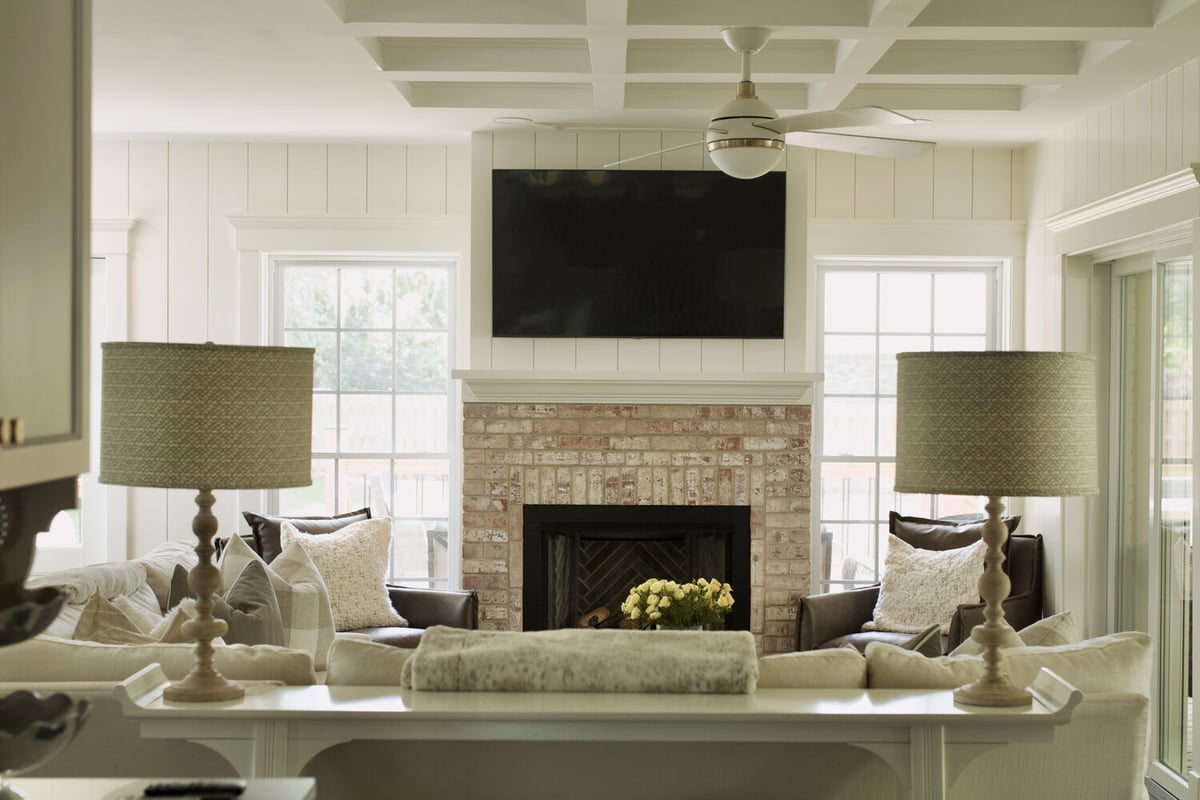 Finished custom living room with coffered ceiling and brick fireplace by Trade Works Remodeling in Louisville, KY