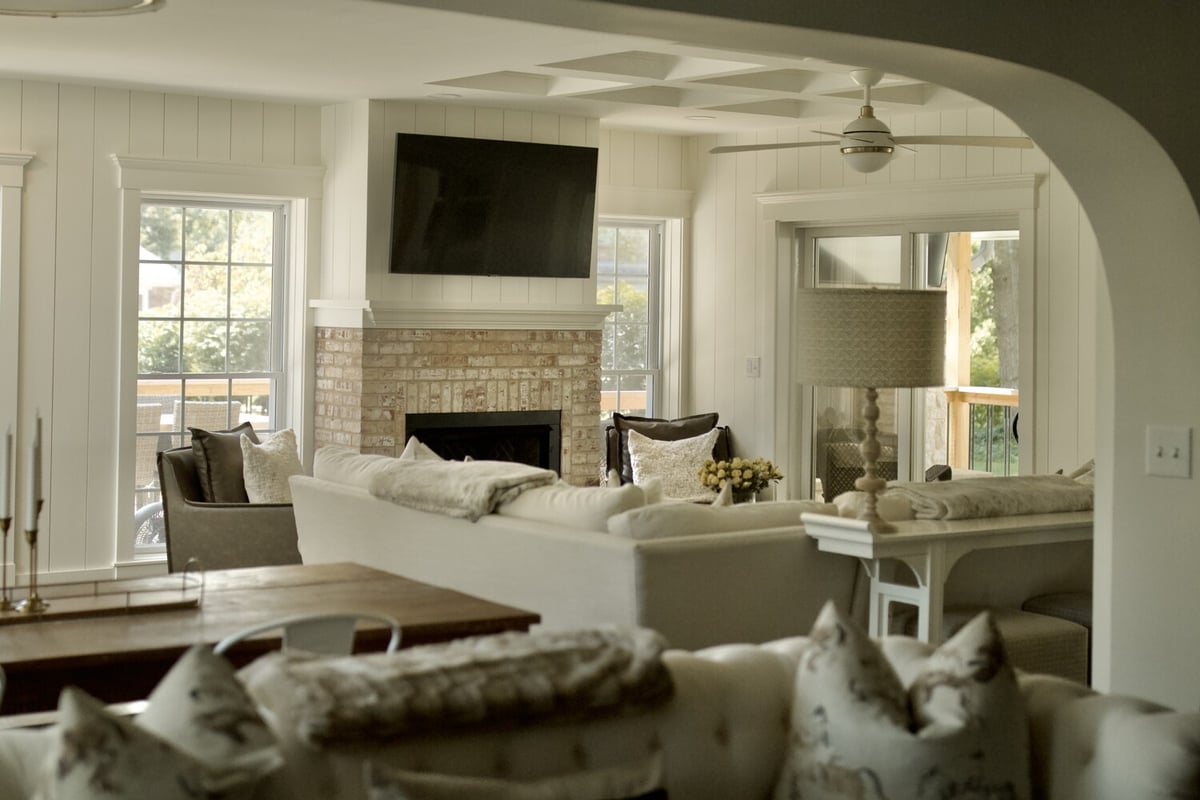 Living room remodel with large windows and fireplace by Trade Works Remodeling in Louisville, KY