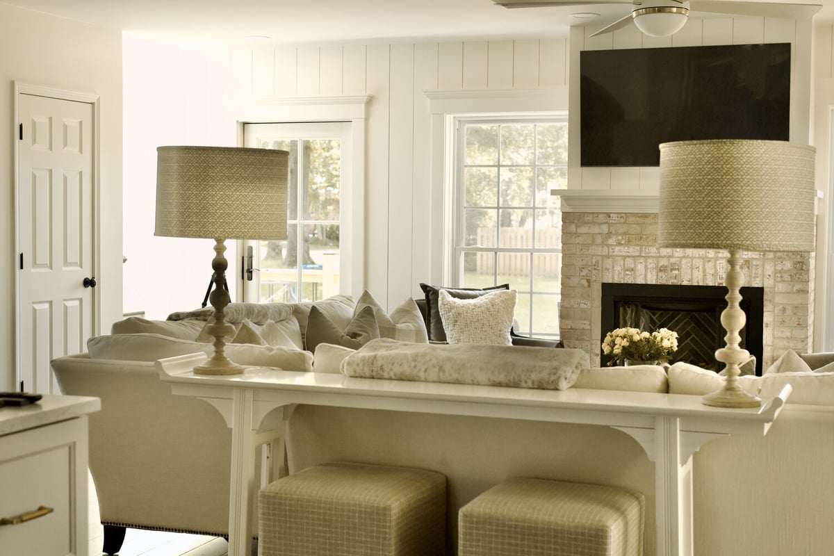 Living room remodel with matching lamps and white sectional sofa by Trade Works Remodeling in Louisville, KY