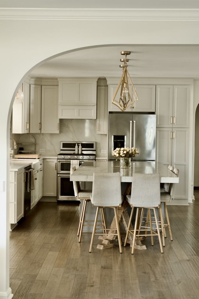 Modern white kitchen renovation with marble counters in Crestwood, KY by Trade Works Remodeling