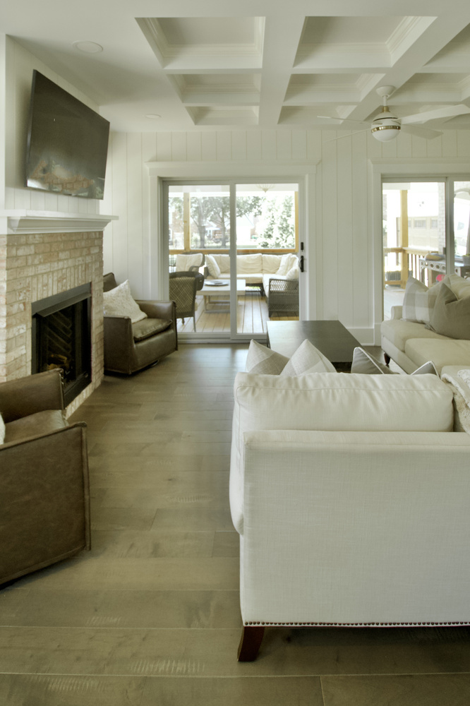 Open living room remodel leading to porch by Trade Works Remodeling in Owl Creek, KY