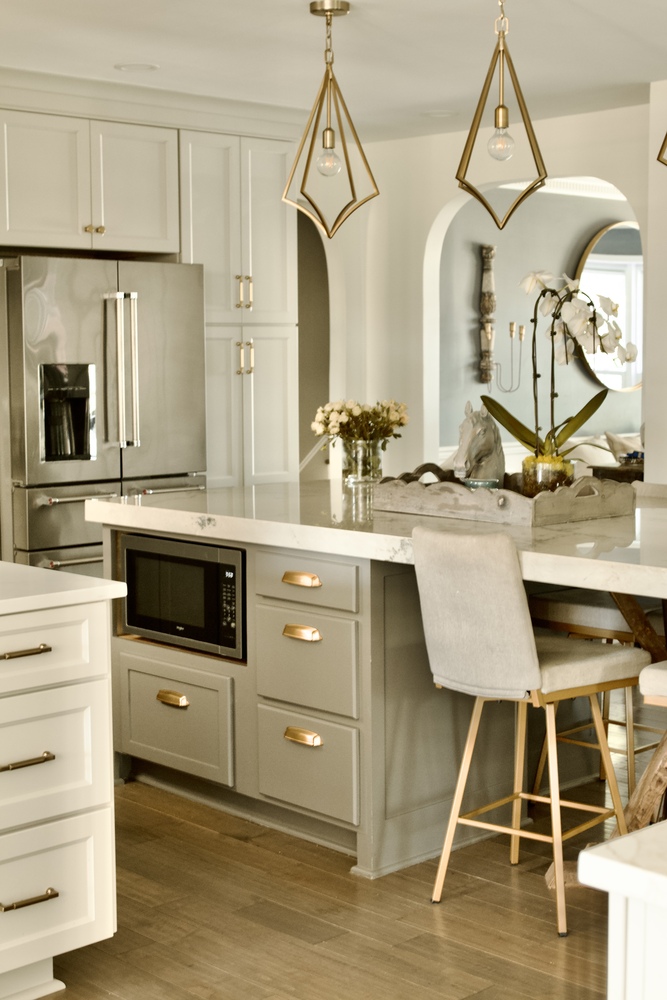 Stylish custom kitchen with modern gold pendant lighting by Trade Works Remodeling in Louisville, KY