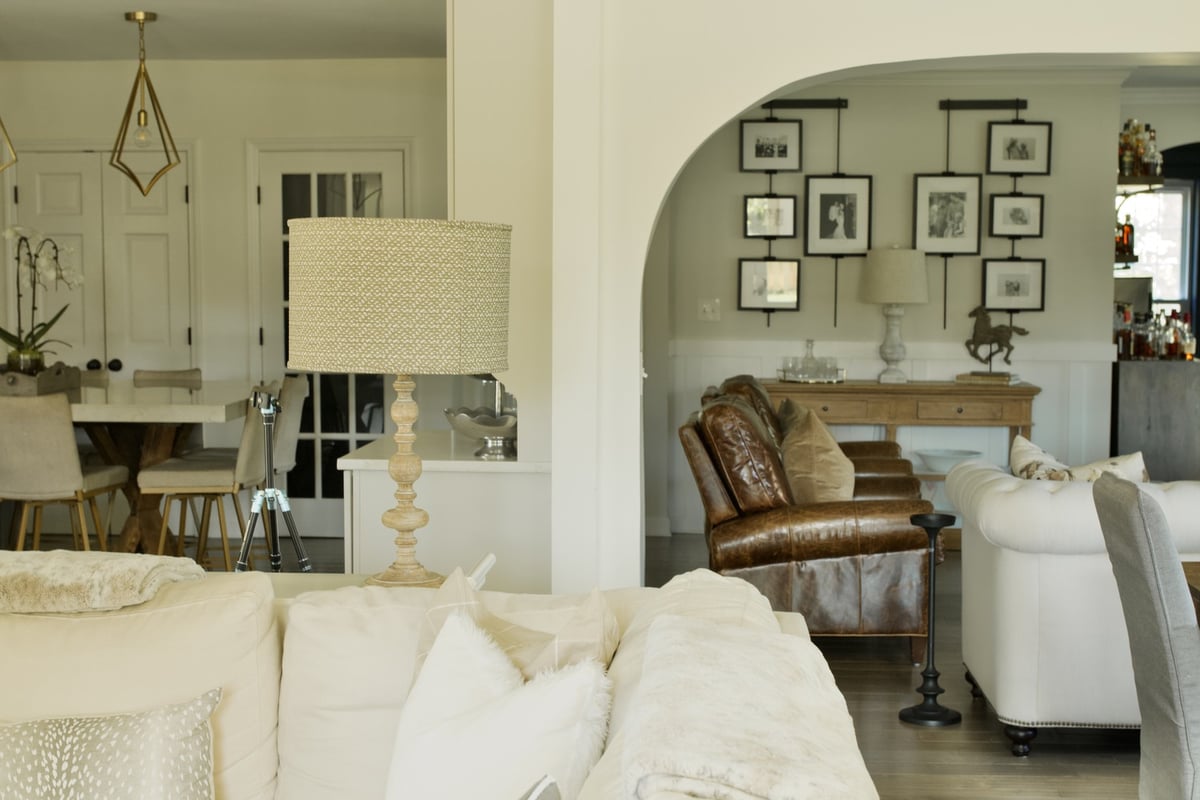 Transitional living space connecting kitchen and sitting room in a Louisville custom home by Trade Works Remodeling