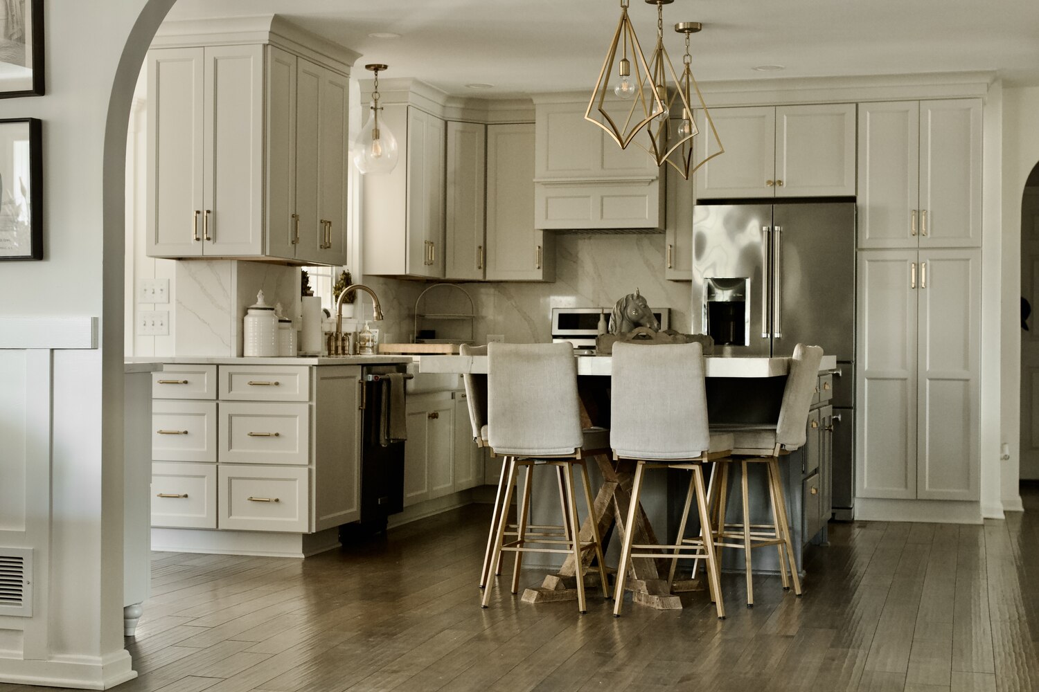 Wide view of remodeled kitchen with pendant lights by Trade Works Remodeling in Louisville, KY