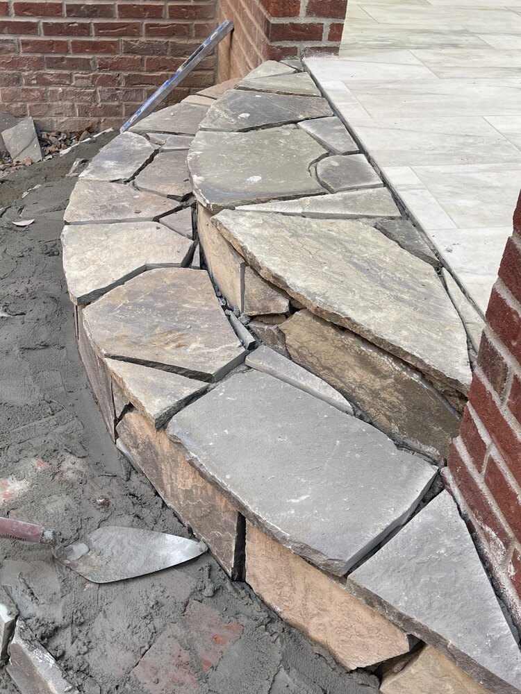 Close-up of stone step masonry for patio addition by Trade Works Remodeling in Louisville, KY