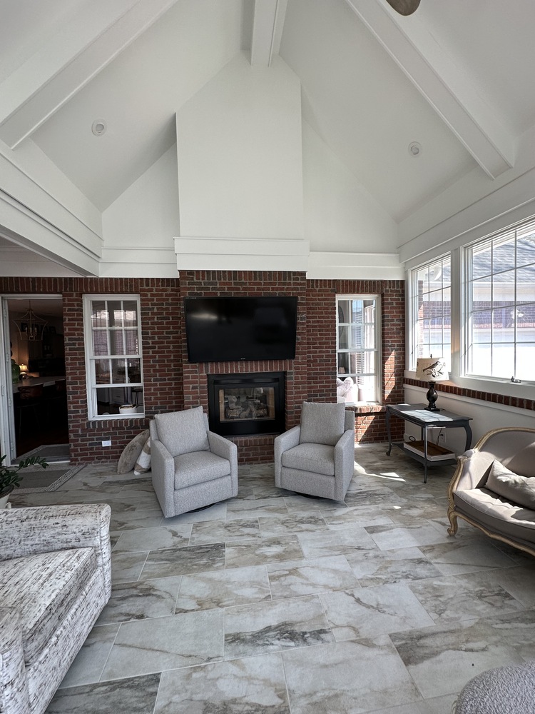 Custom home sunroom with brick fireplace by Trade Works Remodeling in Greymoor, KY