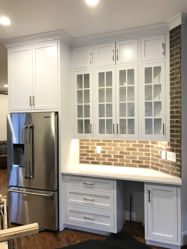 Custom kitchen remodel with stainless fridge and brick backsplash by Trade Works Remodeling in Louisville, KY