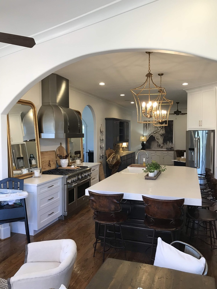 Custom kitchen with oversized island and gold pendant lights by Trade Works Remodeling in Crestwood, KY