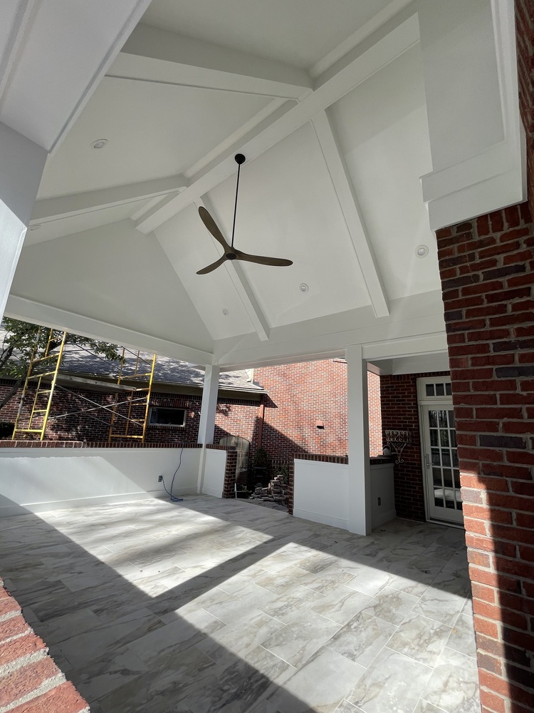 Custom patio interior with tiled flooring and vaulted ceiling in Louisville, KY by Trade Works Remodeling