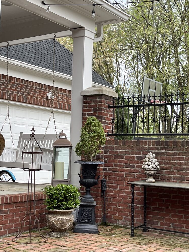 Outdoor brick patio with custom landscaping by Trade Works Remodeling in Louisville, KY