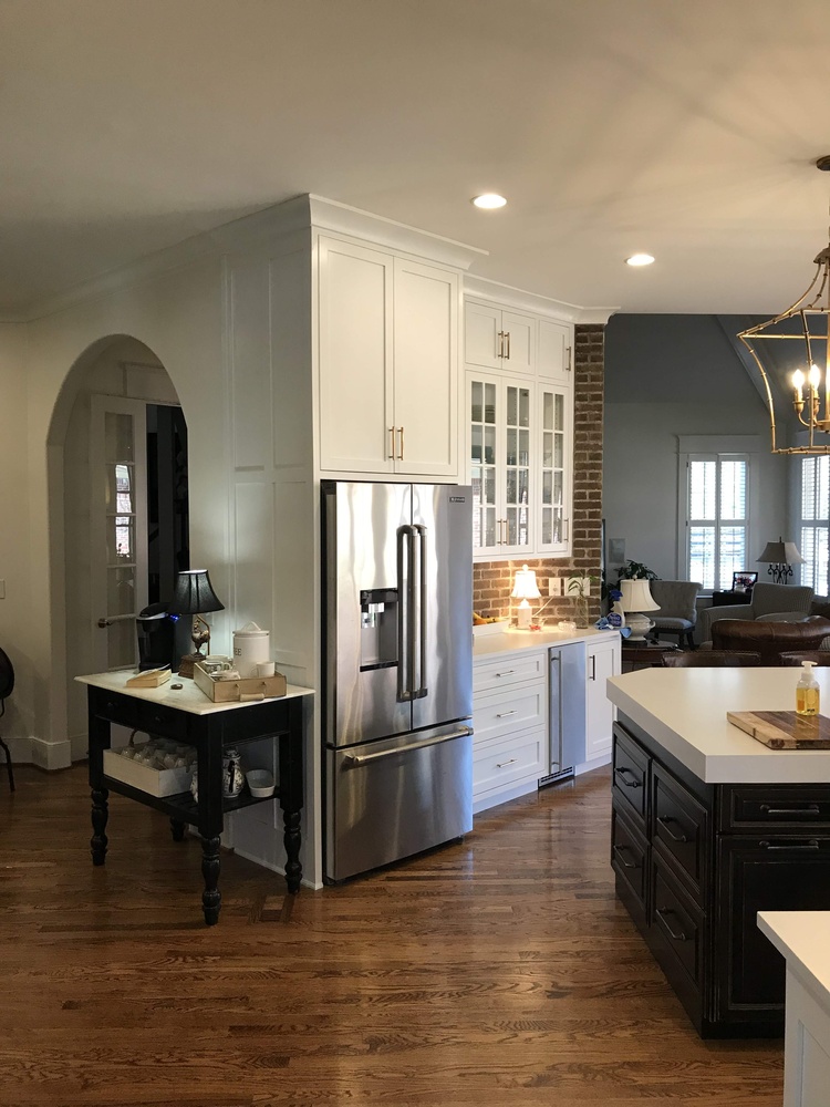 Stainless steel refrigerator and white cabinetry installed in custom kitchen by Trade Works Remodeling in Asbury Park, KY