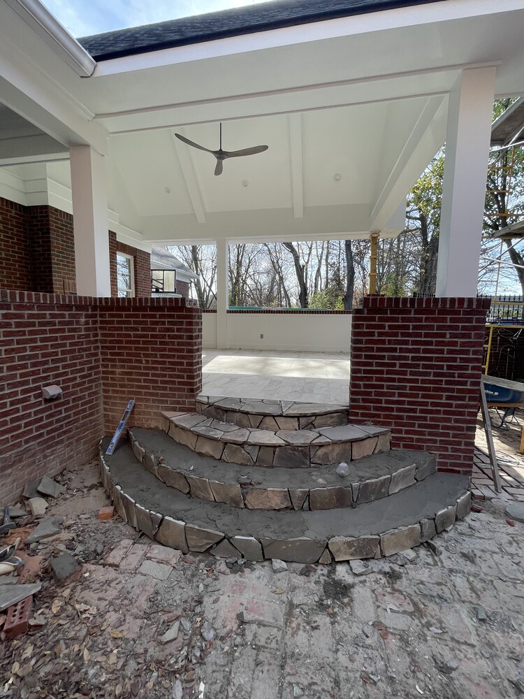 Stone steps under construction for custom patio by Trade Works Remodeling in Louisville, KY