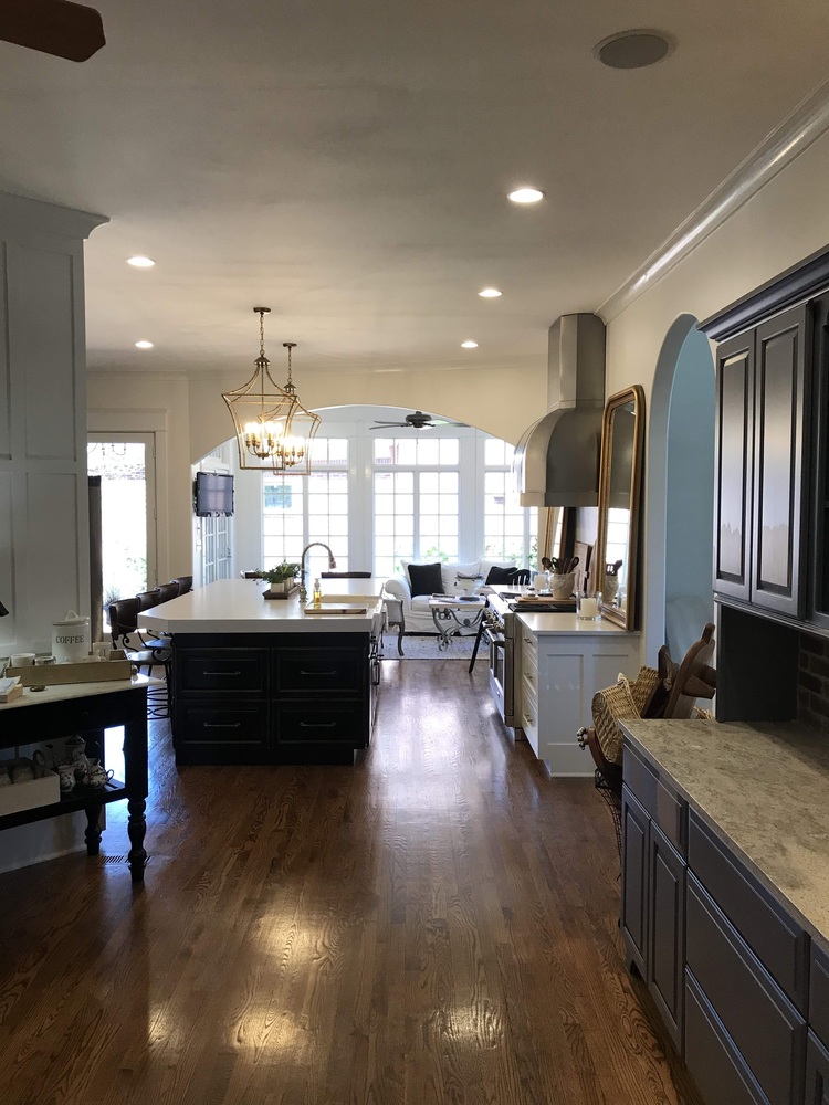 Wide view of renovated open kitchen with large island by Trade Works Remodeling in Prospect, KY