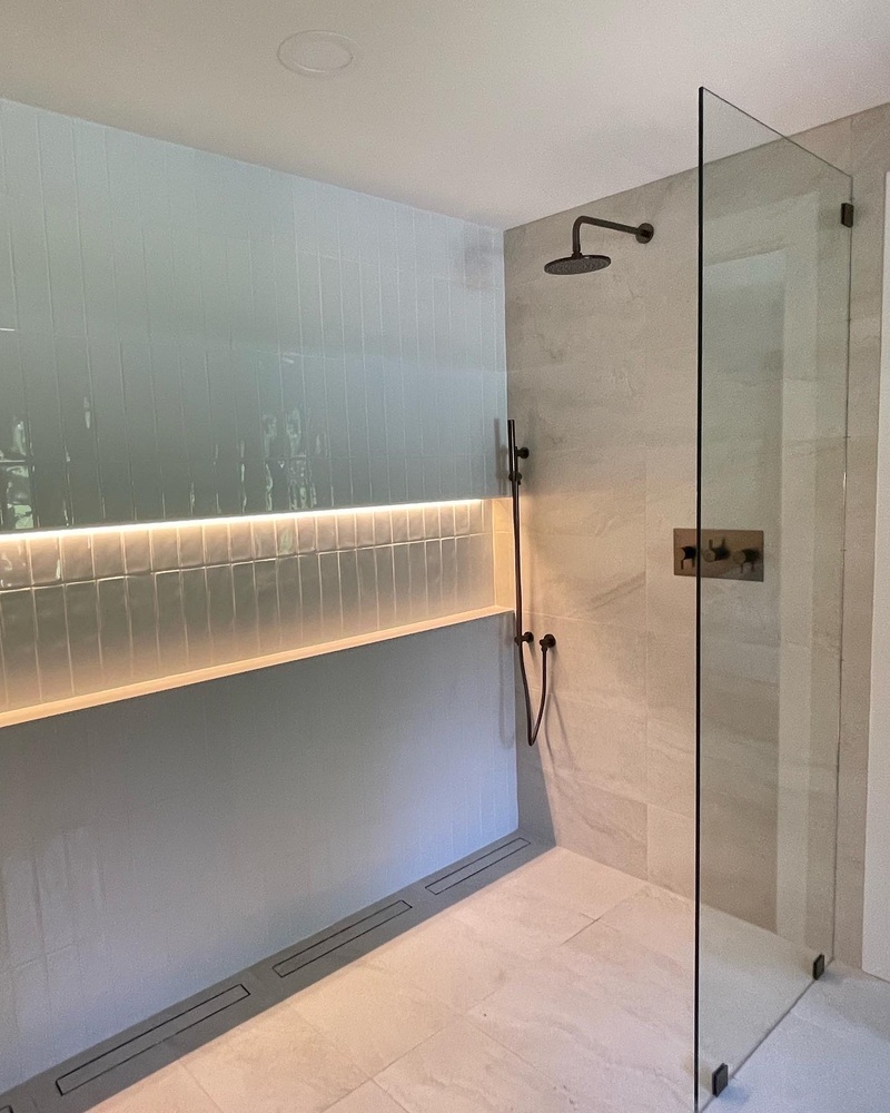 Walk-in shower remodel with rainfall showerhead and linear drain by Trade Works Remodeling in Louisville, KY