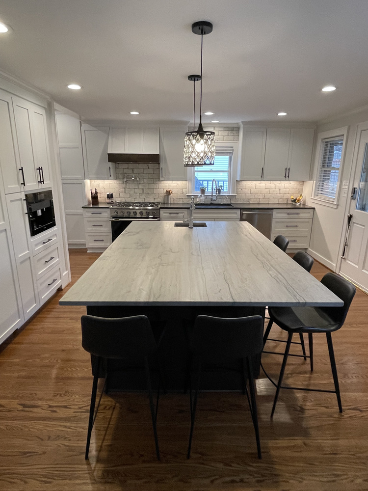 Custom home kitchen remodel with modern island and seating in Louisville, KY by Trade Works Remodeling