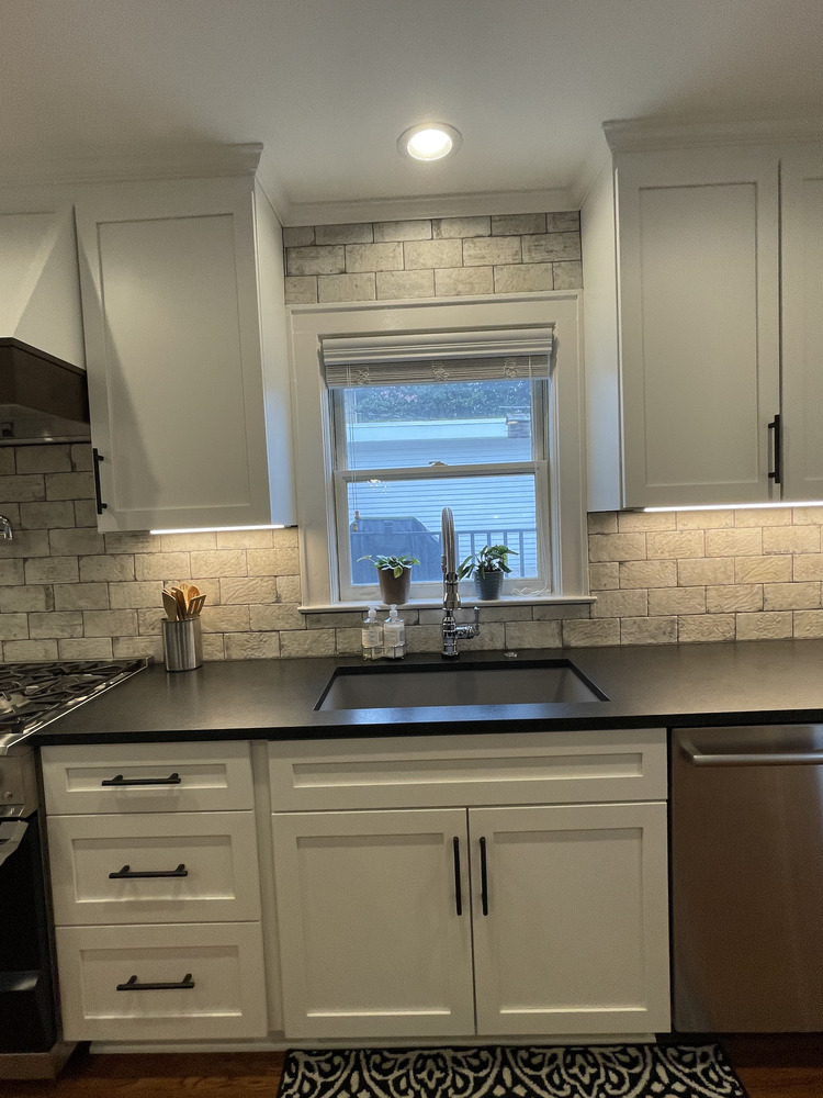 Douglass kitchen renovation by Trade Works Remodeling featuring window view and tile backsplash