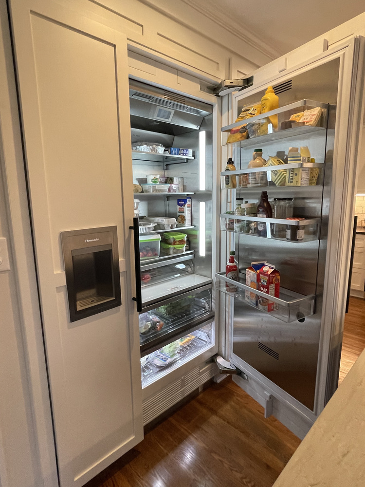 High-end refrigerator integration in kitchen cabinetry in Anchorage, KY by Trade Works Remodeling