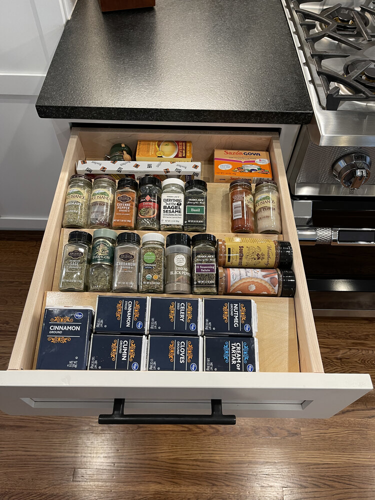 Organized spice drawer installation in Louisville custom kitchen by Trade Works Remodeling