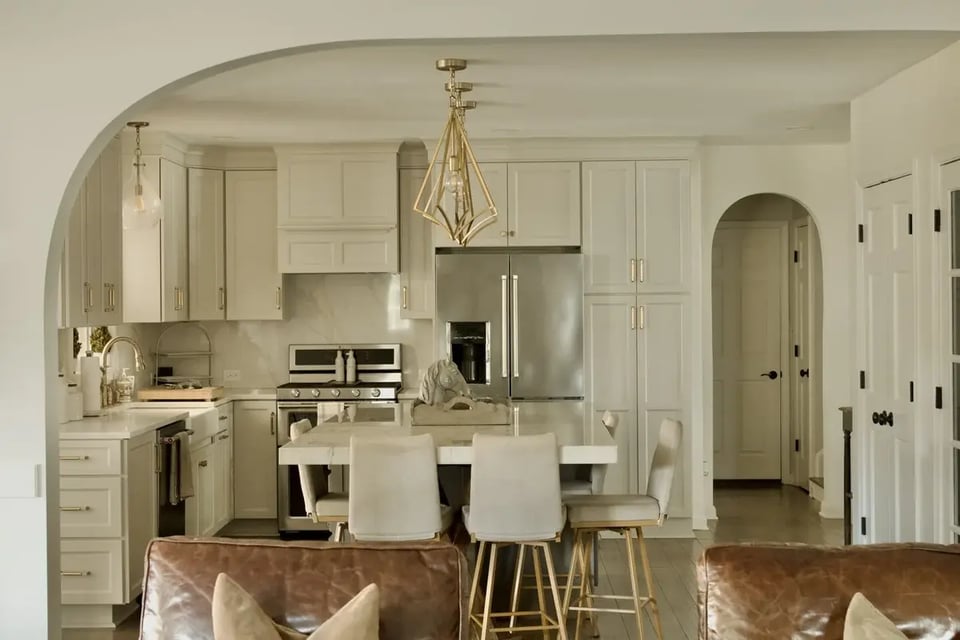 Modern kitchen remodel with island and pendant lights by Trade Works Remodeling in Louisville, KY