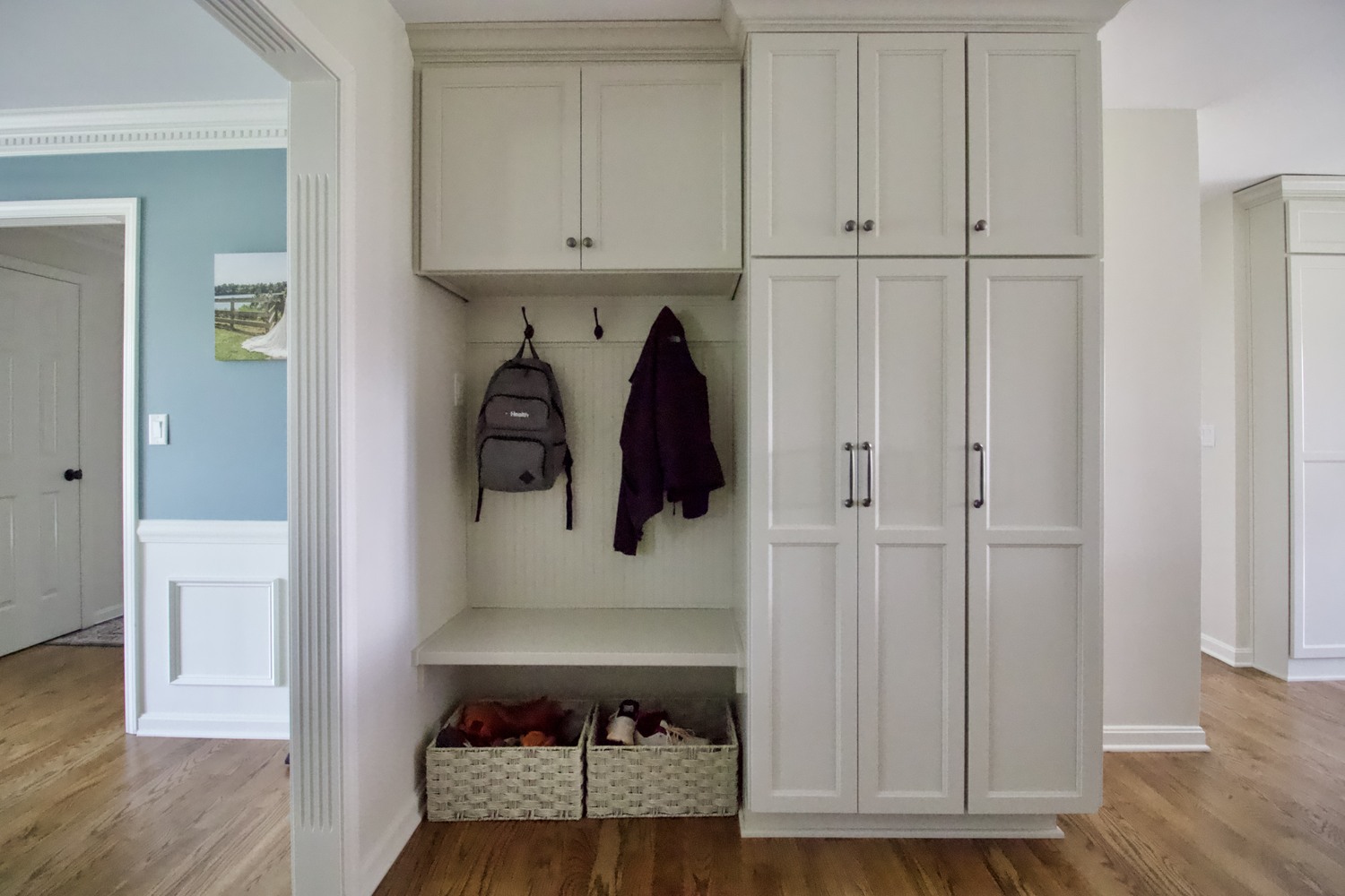 Custom home mudroom with built-in storage and hooks in Bancroft, KY by Trade Works Remodeling