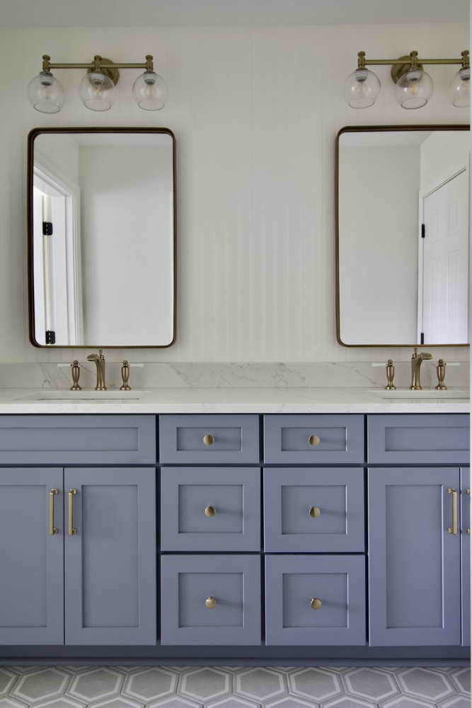 Modern bathroom vanity with blue cabinets and quartz countertop by Trade Works Remodeling in Owl Creek, KY